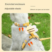 Yellow cat harness with bee decoration.