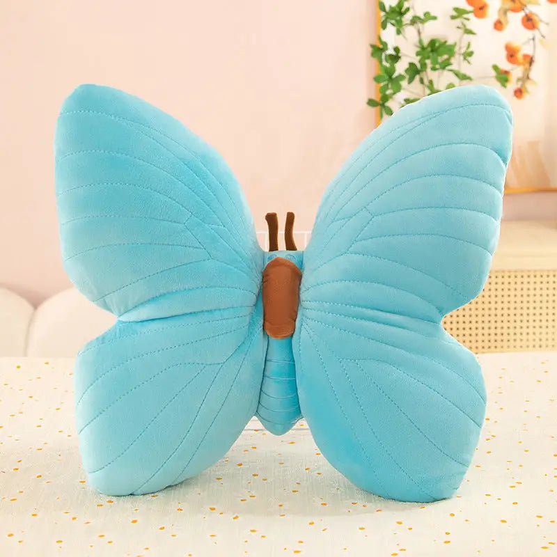 Blue butterfly plush pillow.