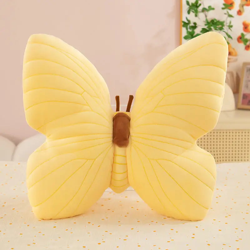 Yellow butterfly plush pillow.