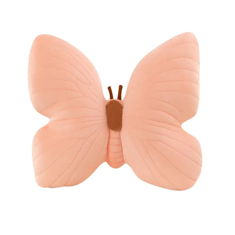 Peach-colored butterfly pillow.
