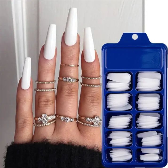 White coffin-shaped press-on nails.
