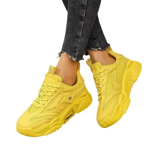 Yellow chunky sneakers.