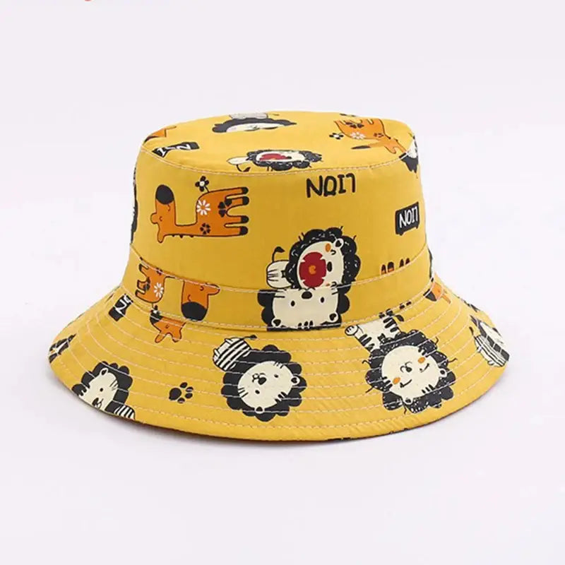 Yellow bucket hat with lion cartoon pattern.