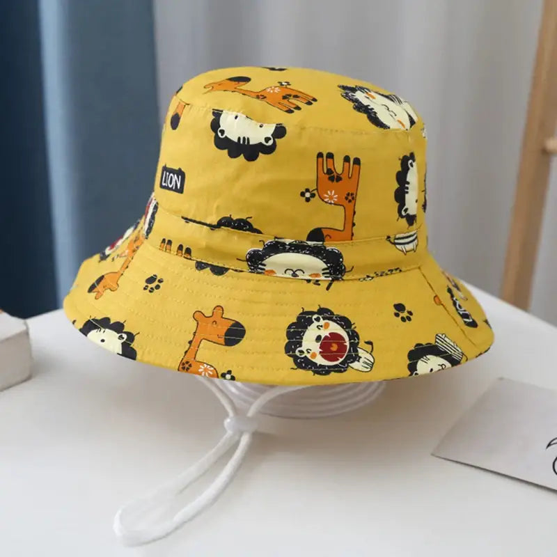 Yellow bucket hat with animal print.