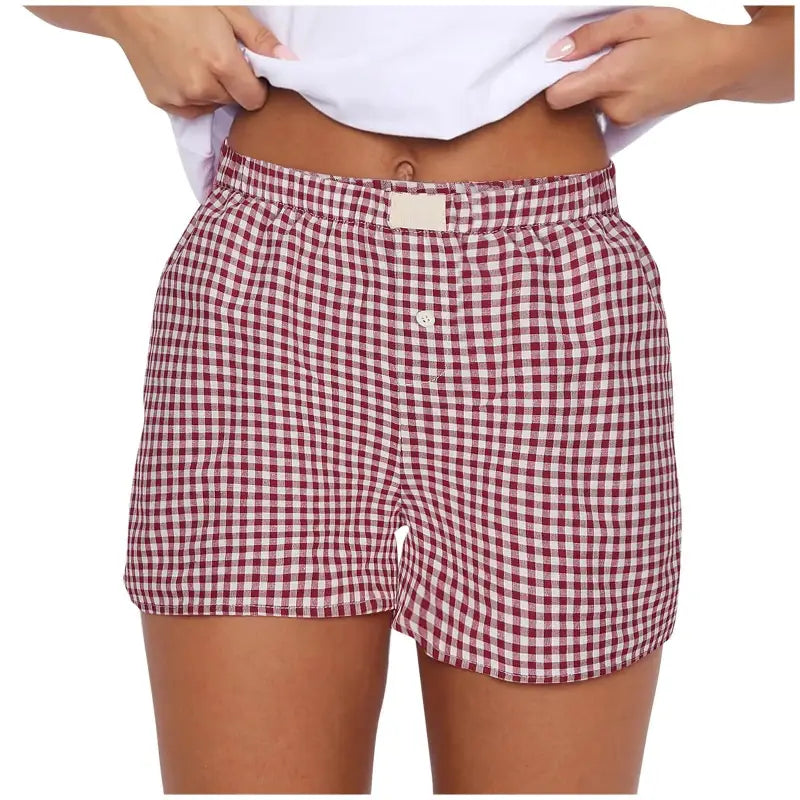 Burgundy and white checkered boxer shorts.