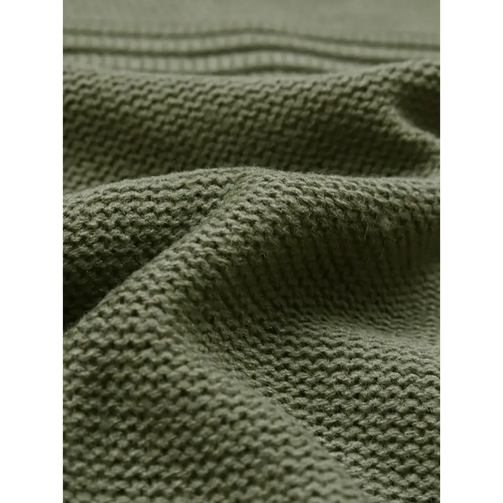 Olive green knitted fabric.