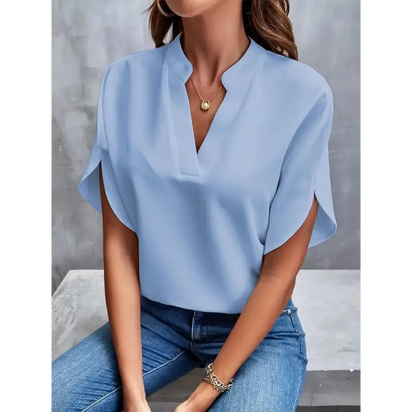 Light blue V-neck blouse.