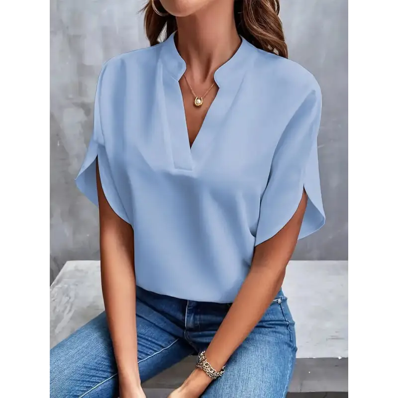 Light blue V-neck blouse.