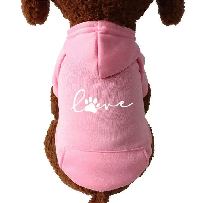 Pink dog hoodie with ’love’ paw print.