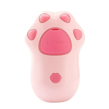 Pink cat paw-shaped pet spa device for gentle grooming with a Cat Spray Comb or spray comb