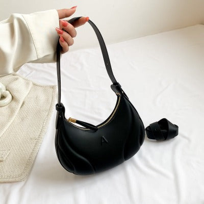 black cresent shape purse