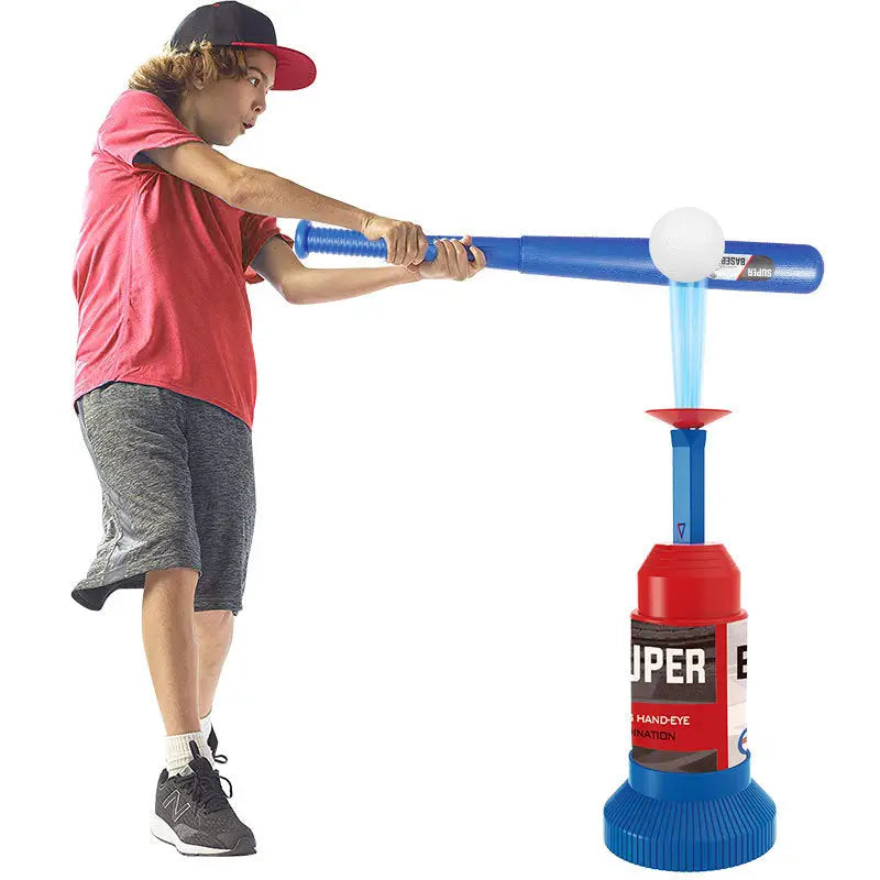 Boy playing with a toy baseball set.