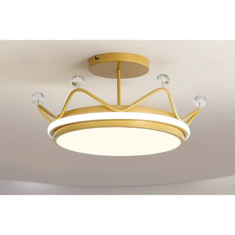 Gold crown-shaped ceiling light.