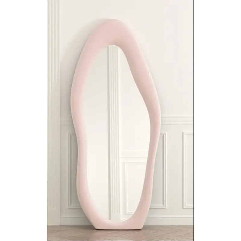 Irregularly shaped pink mirror.