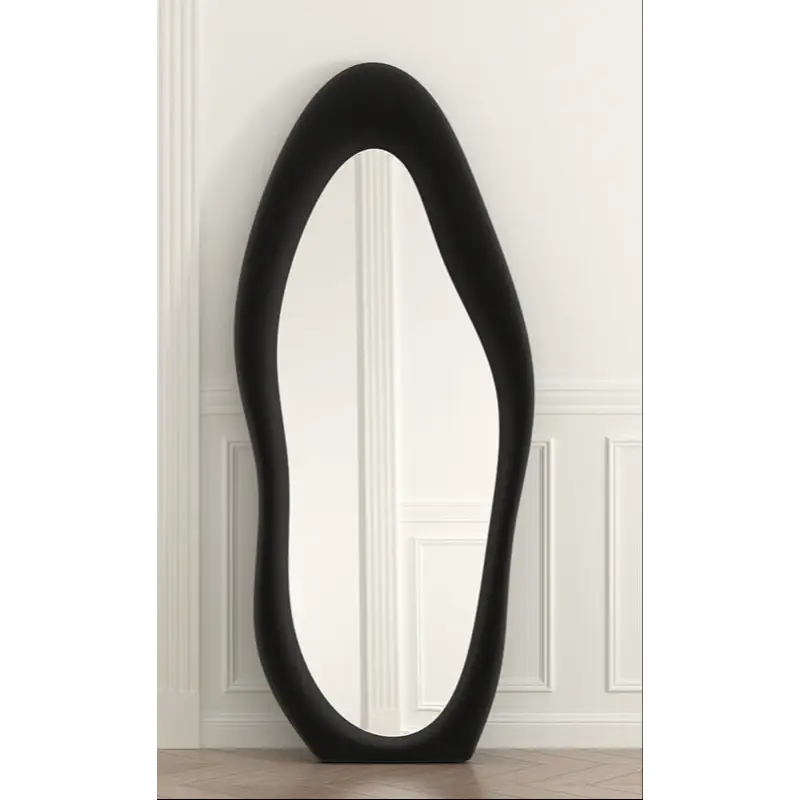 Asymmetrical black-framed mirror.