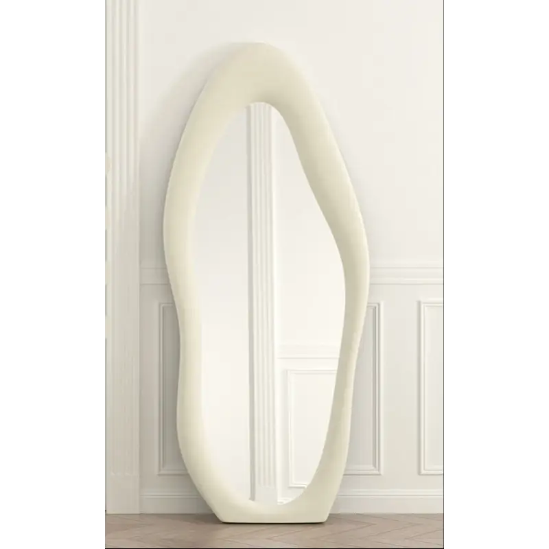 Asymmetrical white floor mirror.