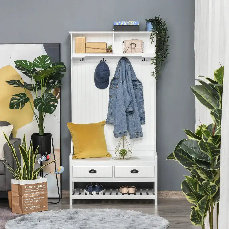 White hall tree with storage for shoes and coats in a multifunctional coat rack shoe bench