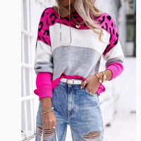 Color-blocked sweater with leopard print.