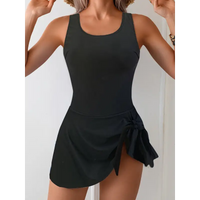 Black one-piece swimsuit with skirt.