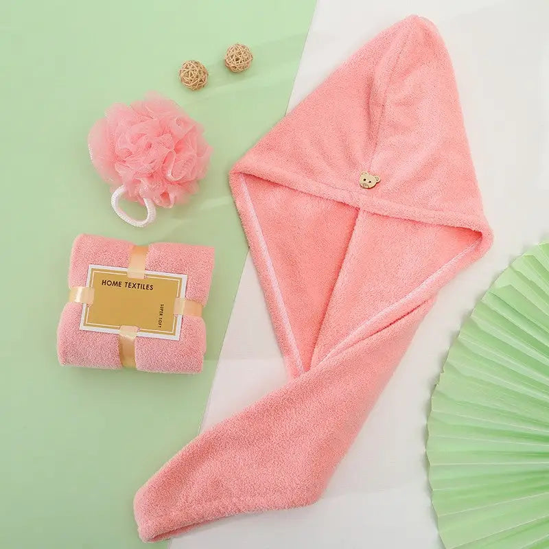 Pink hair towel with button.