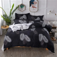 Black and white leaf-patterned bedding.