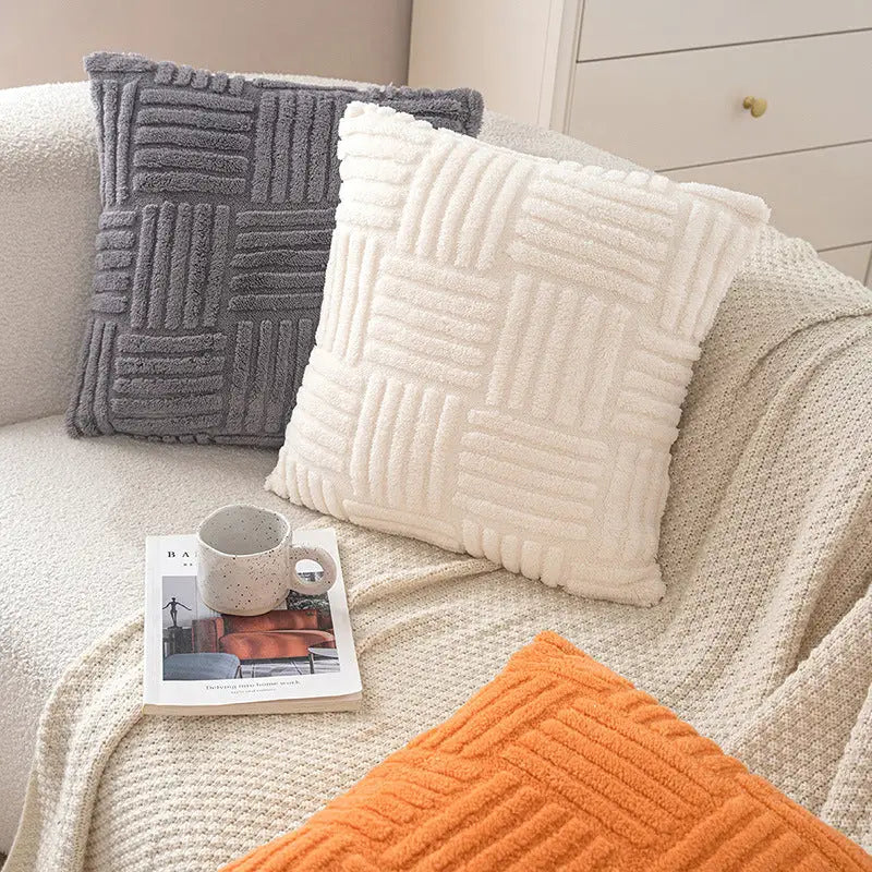 Textured throw pillows with geometric pattern.