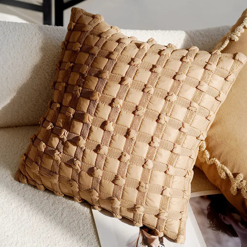 Beige woven throw pillow.