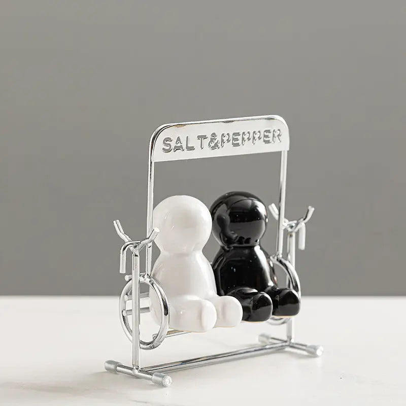 Creative black and white people salt shaker set with shaker on a swing for charming table decor