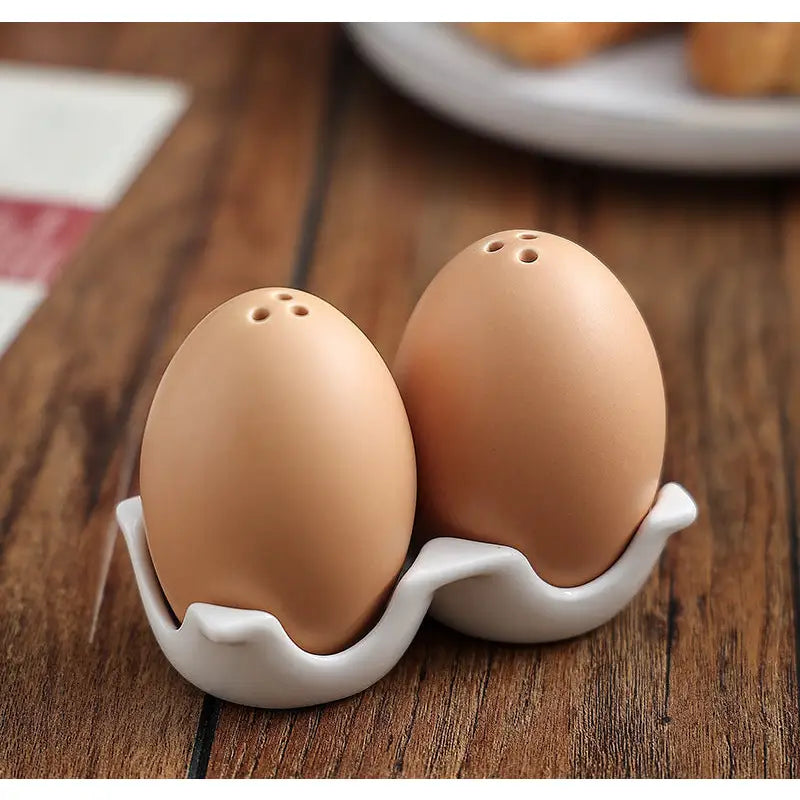 Pun-tastic egg-shaped ceramic salt and pepper shakers for fun tabletop seasoning