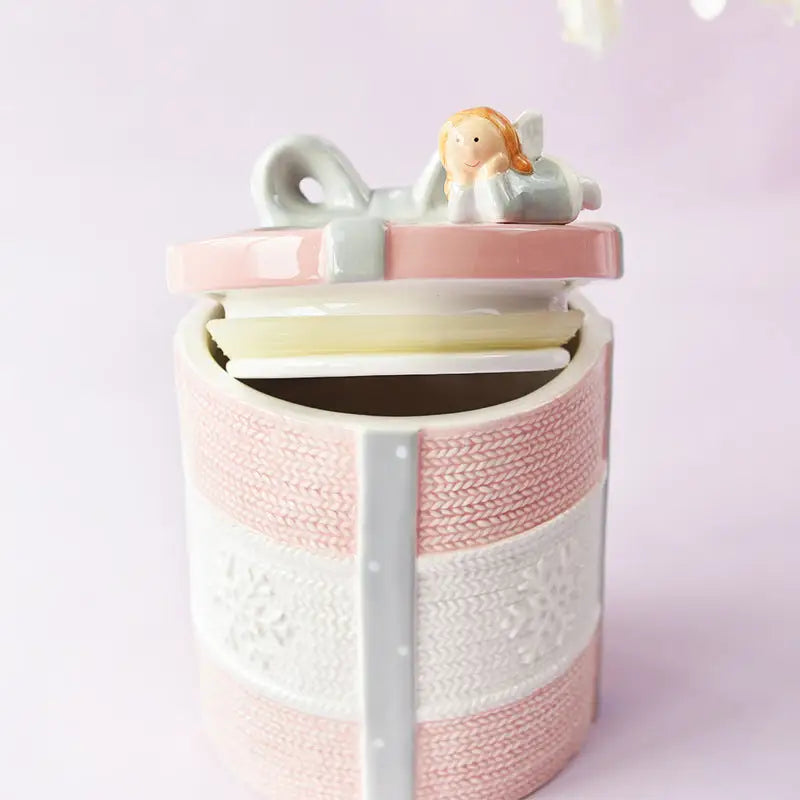 Pink and white ceramic gift-shaped jar with angel figurine for Creative Heart Bow Canister