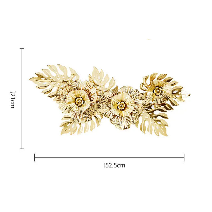 Gold-colored metal floral wall decor.