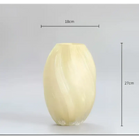 Wrapped, light yellow vase.