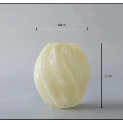 Swirled, translucent, cream-colored vase.