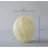 Swirled, translucent, cream-colored vase.