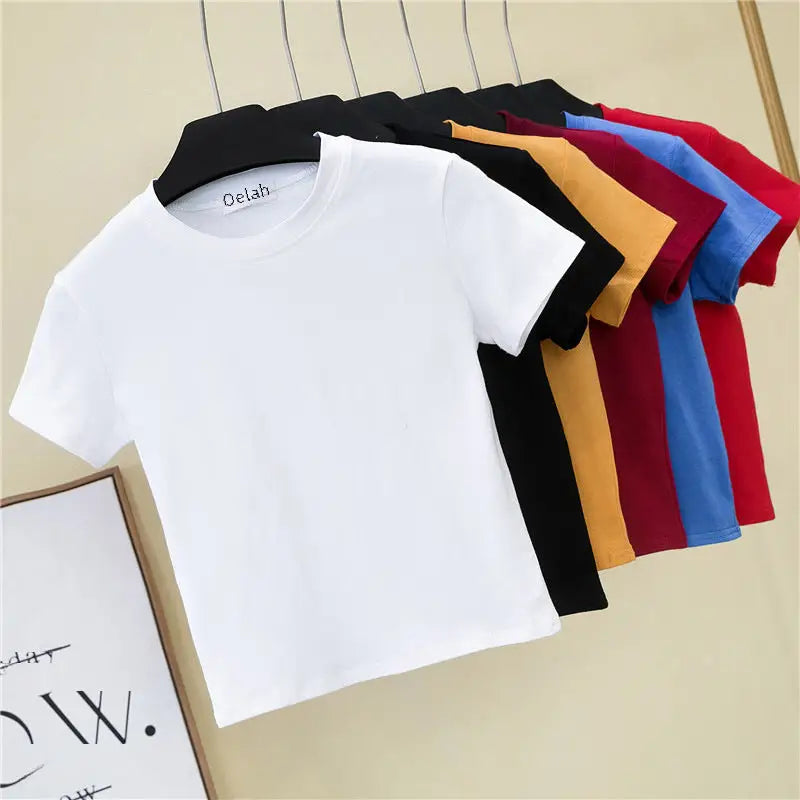 Colorful t-shirts on hangers.