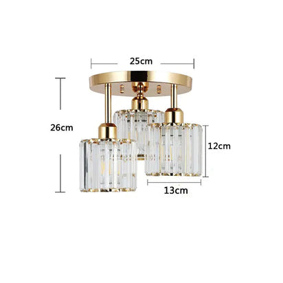 Gold and crystal three-light ceiling fixture.