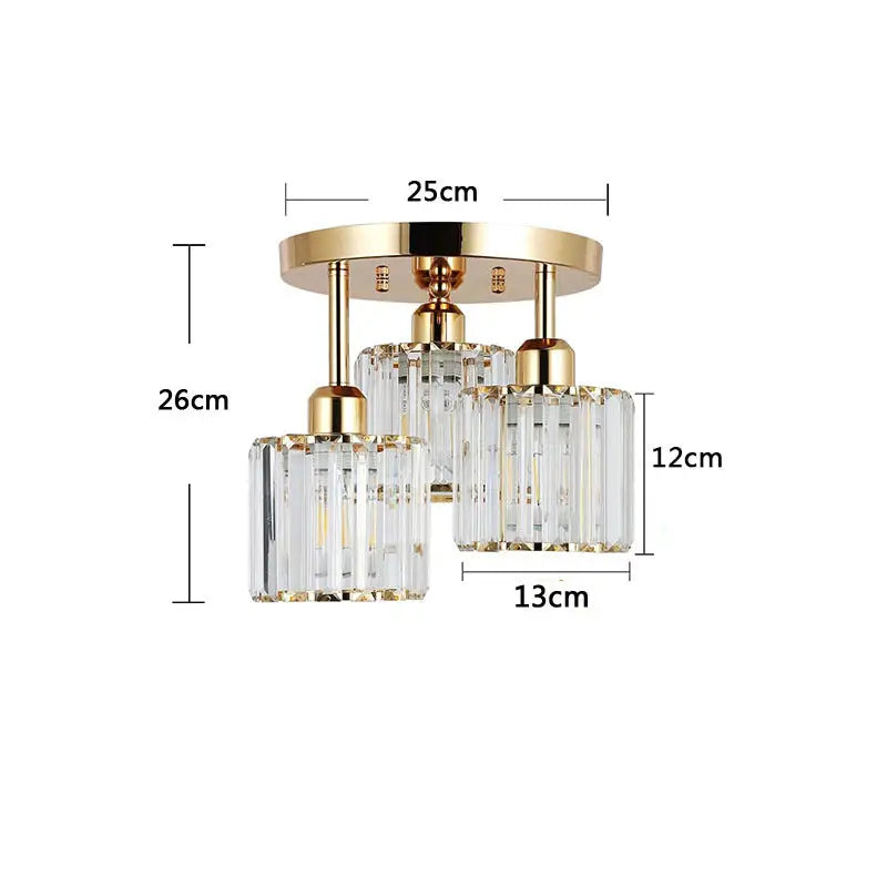 Gold and crystal three-light ceiling fixture.