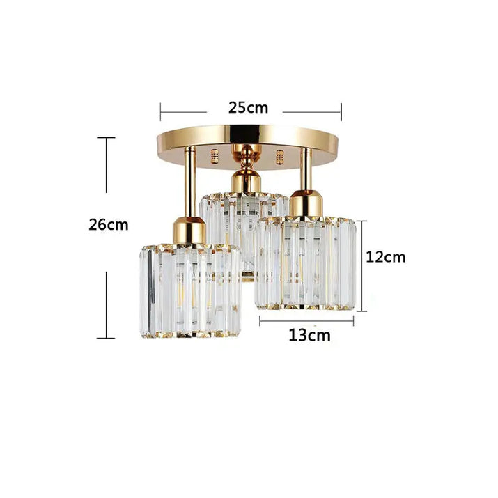 Gold and crystal three-light ceiling fixture.