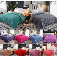 Assorted textured bedspreads.