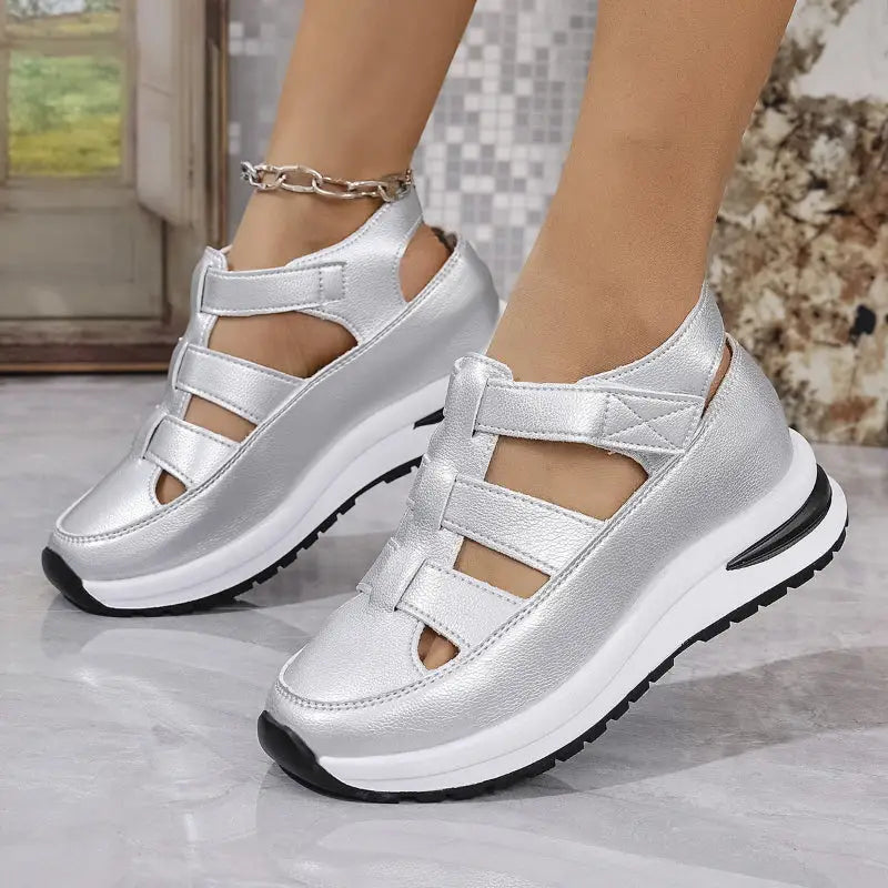 Silver platform wedge sneakers.