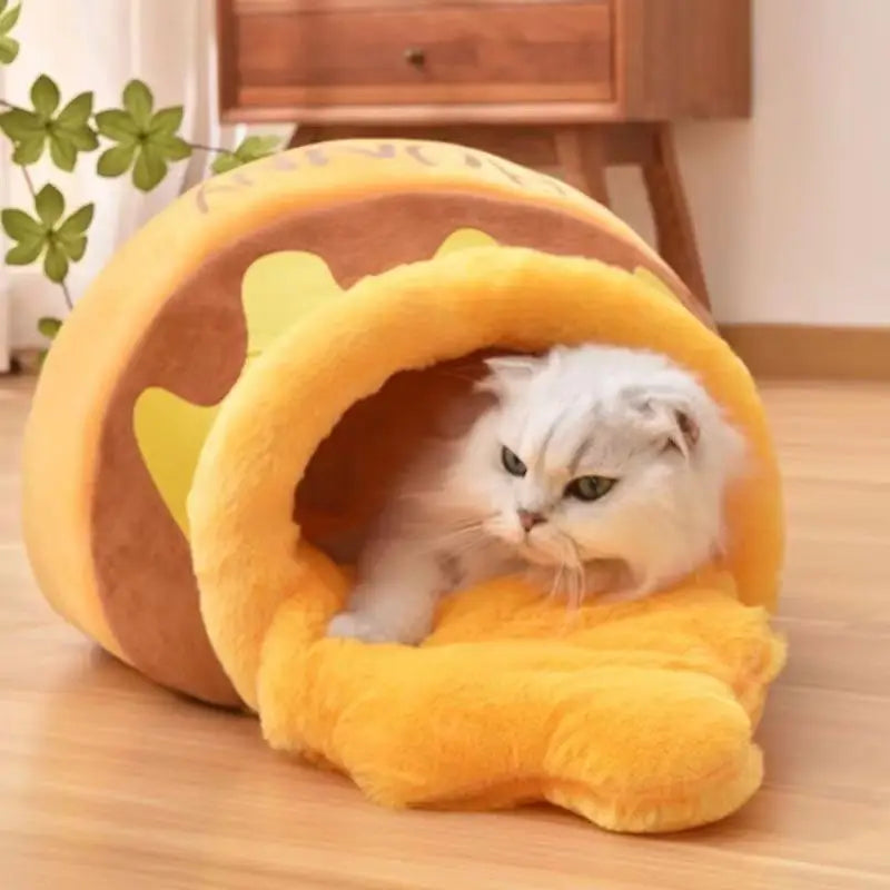 Cat in a plush honey pot bed.