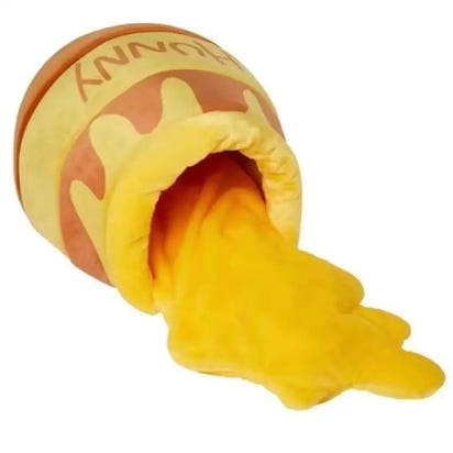 Plush honey pot with overflowing honey.