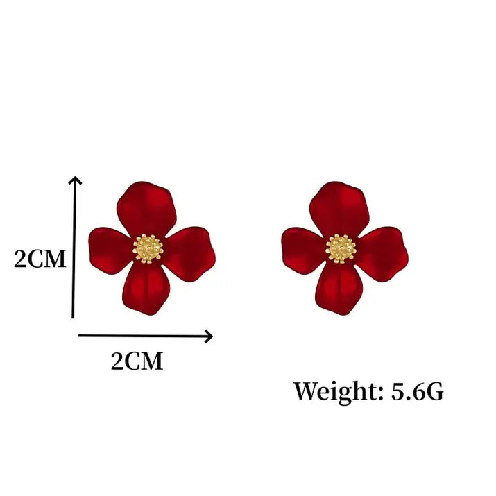 Red flower earrings with gold centers.