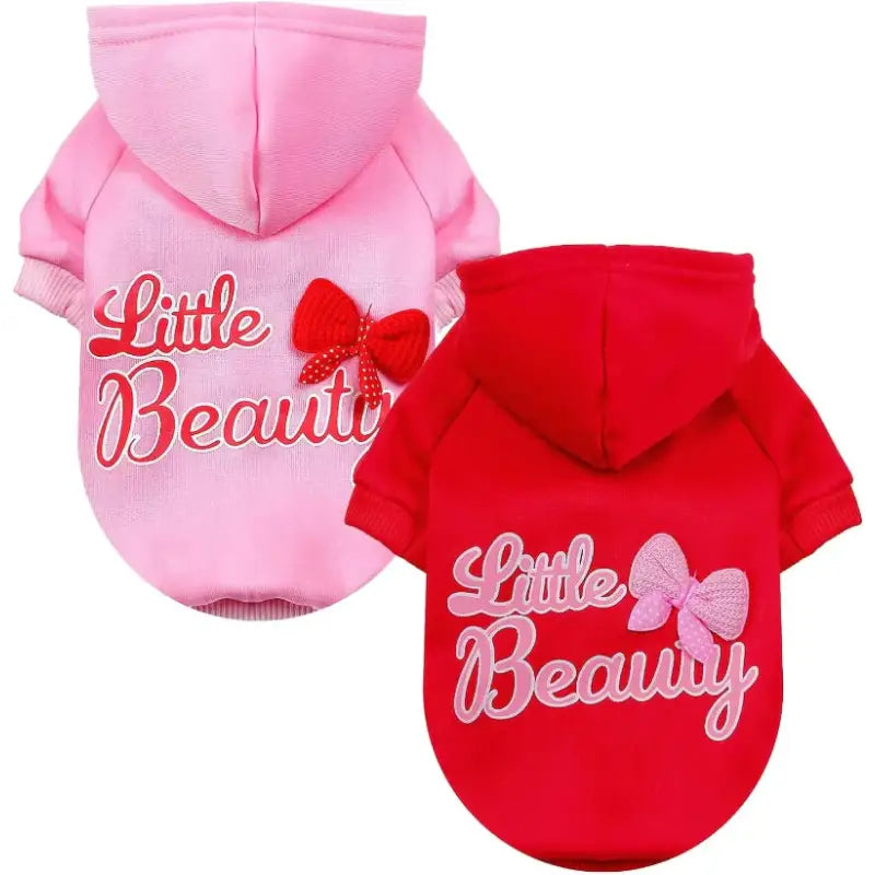 Pink and red dog hoodies.