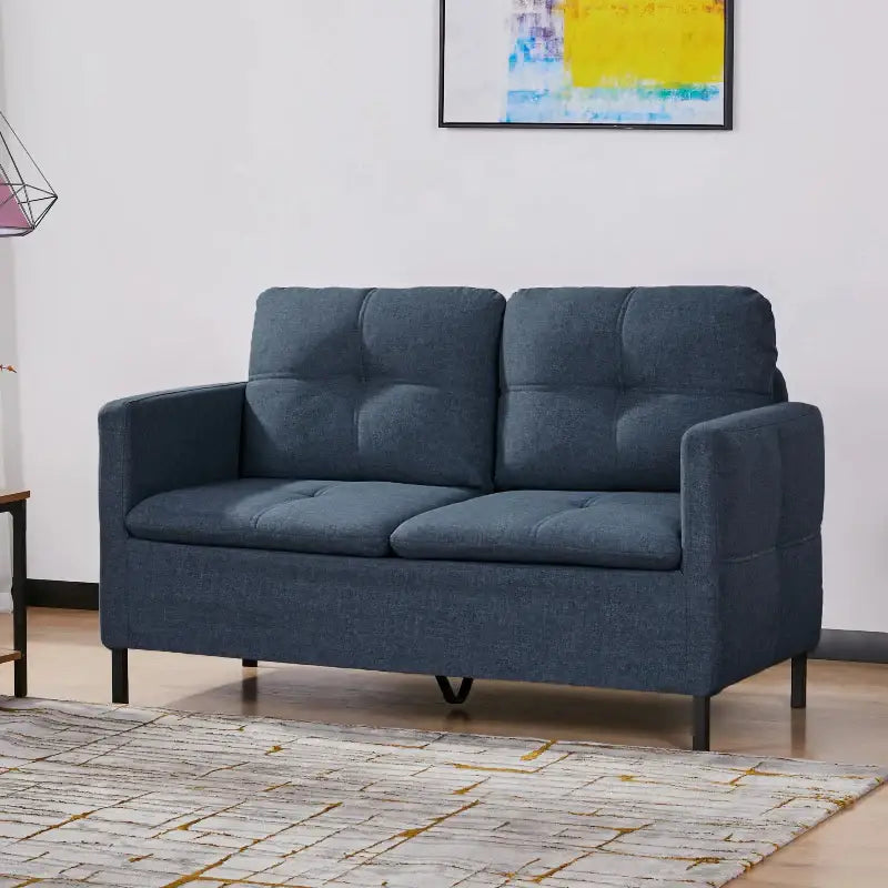 Blue upholstered loveseat.