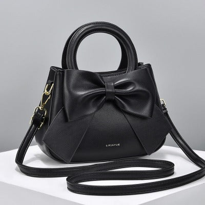 black purse handbag with bow