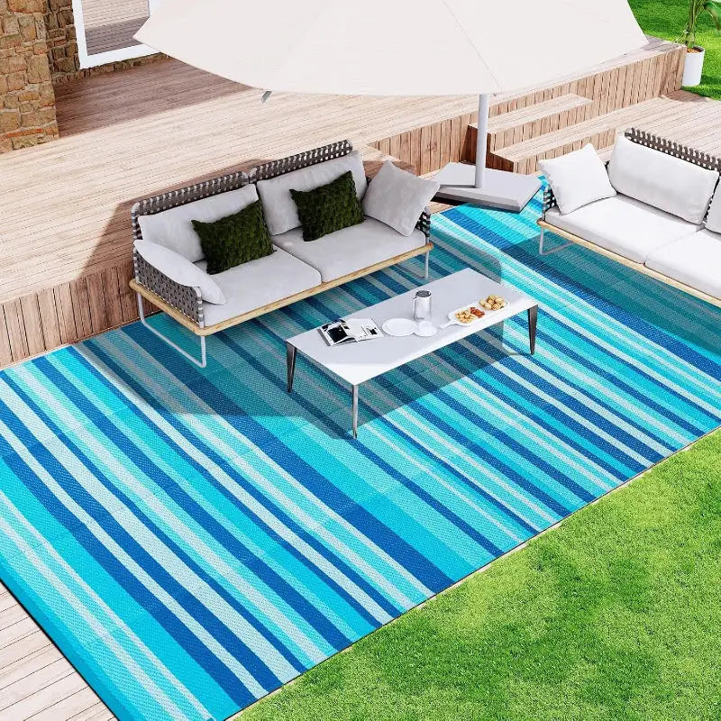 Blue striped outdoor rug for decorative home patio and outdoor space upgrade