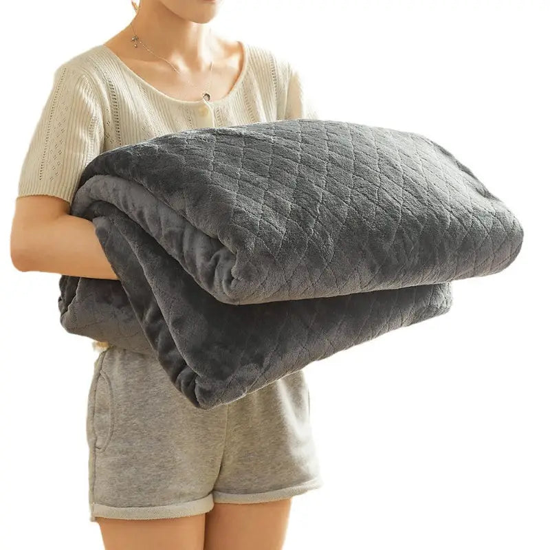 Gray quilted plush blanket.