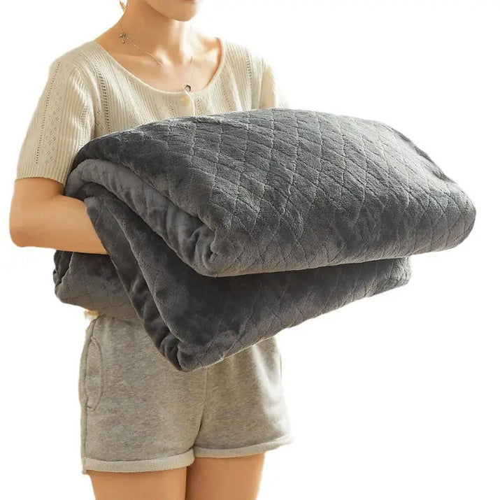 Gray quilted plush blanket.