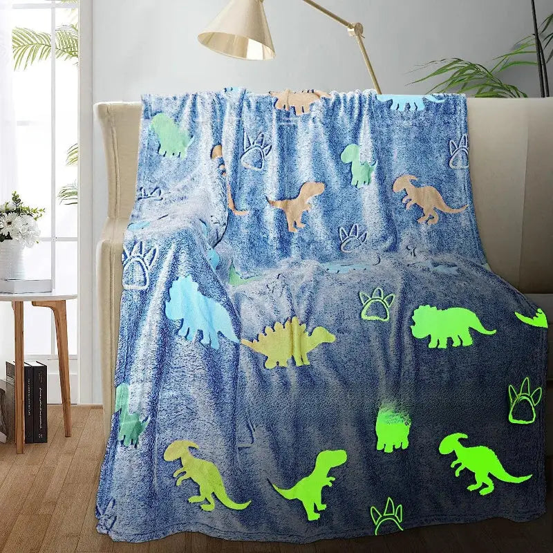 Dinosaur-themed glow-in-the-dark blanket.